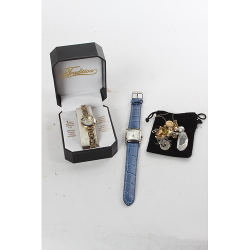 765 - A King Quartz ladies wrist watch, another and a selection of jewellery, badges and more.