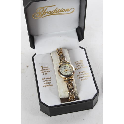 765 - A King Quartz ladies wrist watch, another and a selection of jewellery, badges and more.