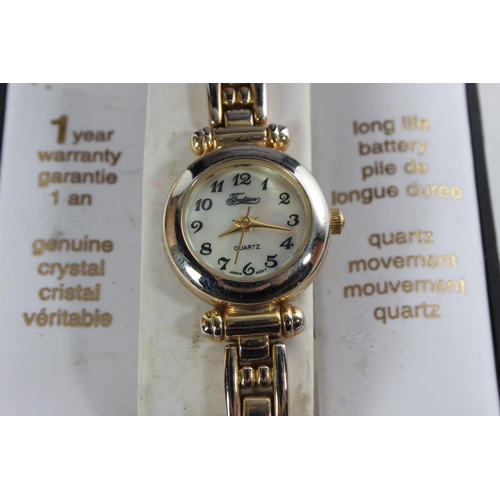 765 - A King Quartz ladies wrist watch, another and a selection of jewellery, badges and more.