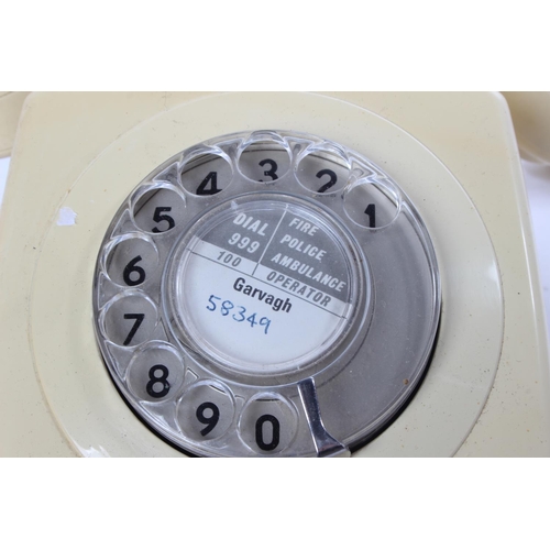 766 - A vintage cream rotary telephone.