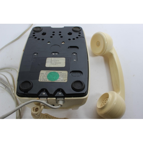 766 - A vintage cream rotary telephone.