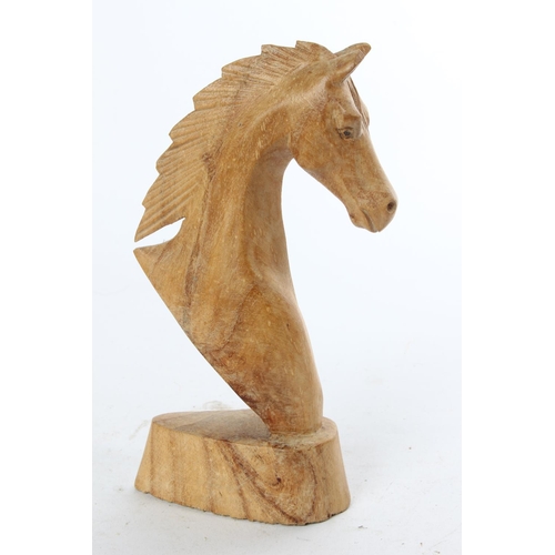 774 - A wooden figure of a horses head.