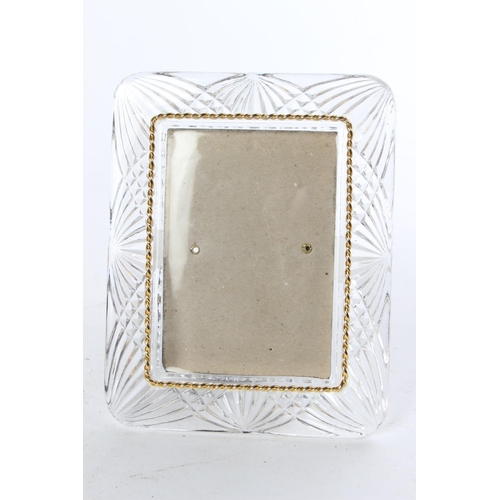 778 - A cut glass photograph frame with gilt beading.