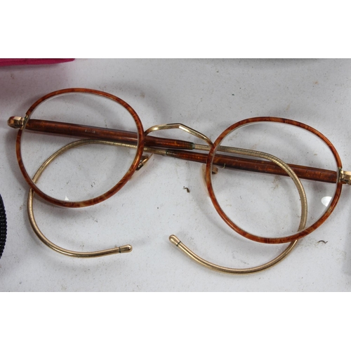 779 - Two antique pairs of glasses and more.