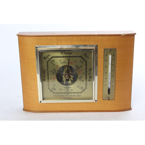 789 - A vintage wooden cased barometer and thermometer.