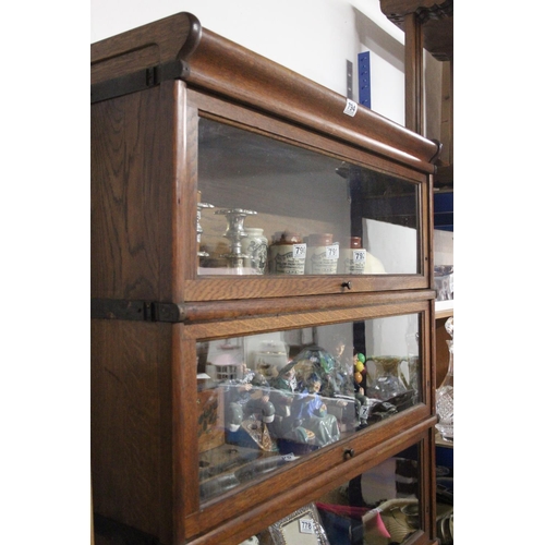 794 - A stunning antique oak five section Barrister bookcase, with glass front, up and over doors, measuri... 