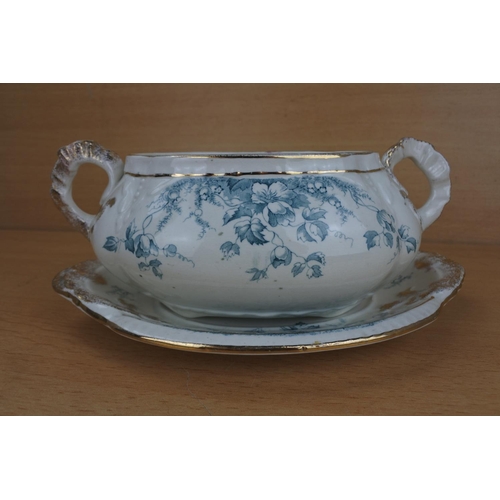 815 - An antique two handled sauce bowl and plate.