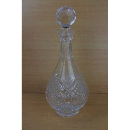 816 - A cut glass decanter and stopper.