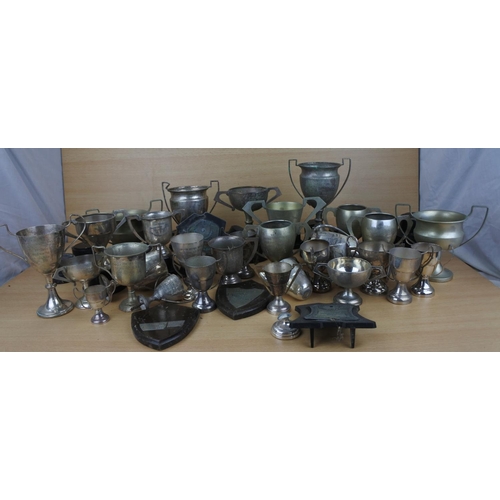 820 - A large lot of silver plated presentation cups.