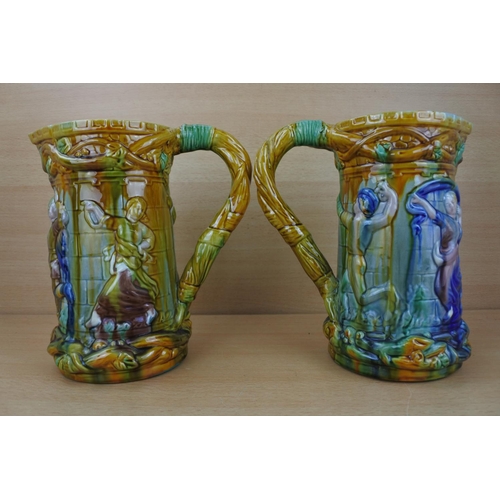 833 - A stunning pair of glazed pottery jugs.