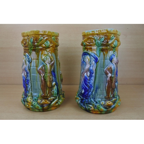 833 - A stunning pair of glazed pottery jugs.