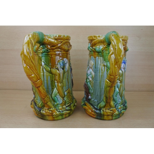 833 - A stunning pair of glazed pottery jugs.