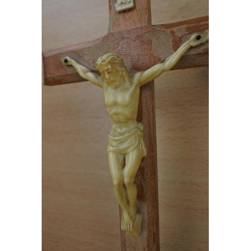 837 - A wooden crucifix wall plaque and another.