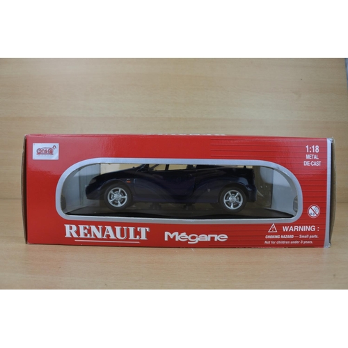 844 - A boxed Anson Renault Megane toy car, scale 1:18.