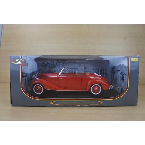 845 - A boxed Signature Models collectors car, scale 1:18.