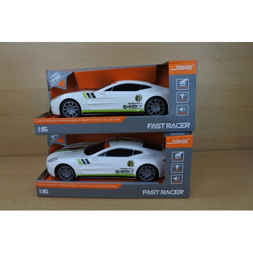 850 - Two boxed Fast Racer cars.