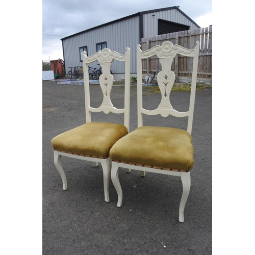 857 - A pair of upcycled chairs with carved detail.