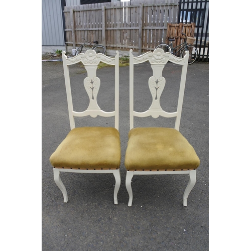 857 - A pair of upcycled chairs with carved detail.