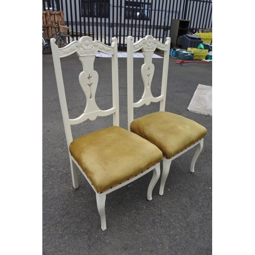 857 - A pair of upcycled chairs with carved detail.