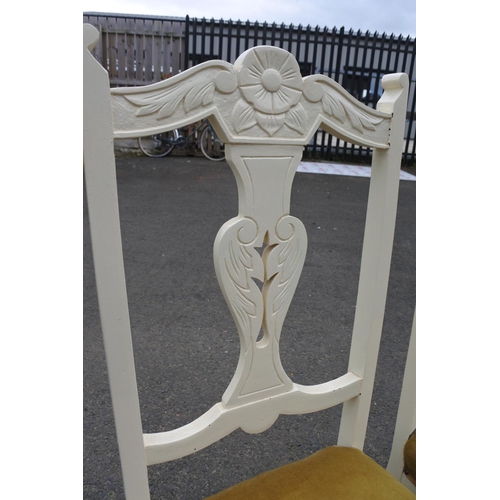 857 - A pair of upcycled chairs with carved detail.