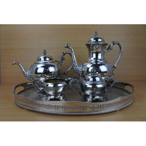 859 - A stunning silver plated tea service on a footed gallery tray.