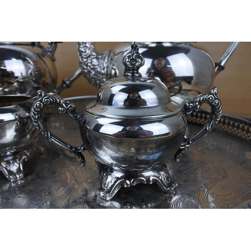 859 - A stunning silver plated tea service on a footed gallery tray.