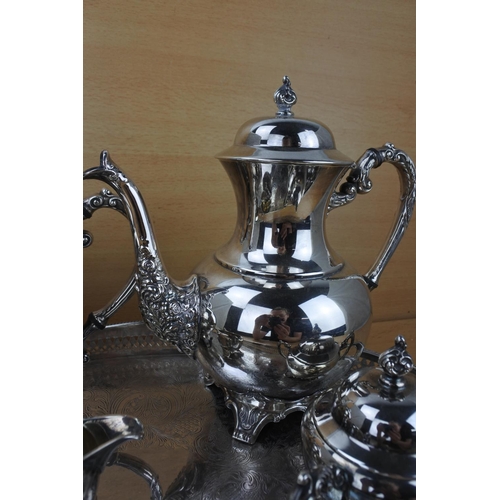 859 - A stunning silver plated tea service on a footed gallery tray.