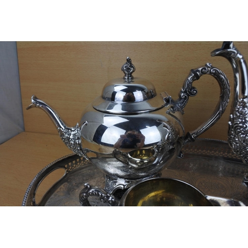 859 - A stunning silver plated tea service on a footed gallery tray.