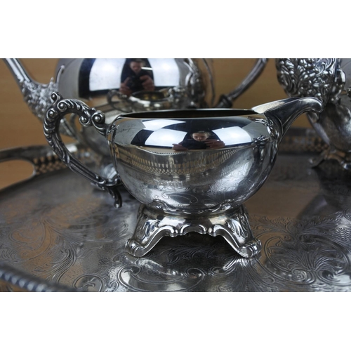 859 - A stunning silver plated tea service on a footed gallery tray.