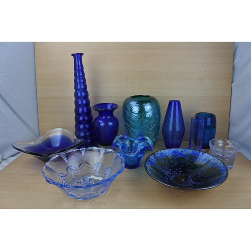 862 - A large collection of vintage blue glass ware.