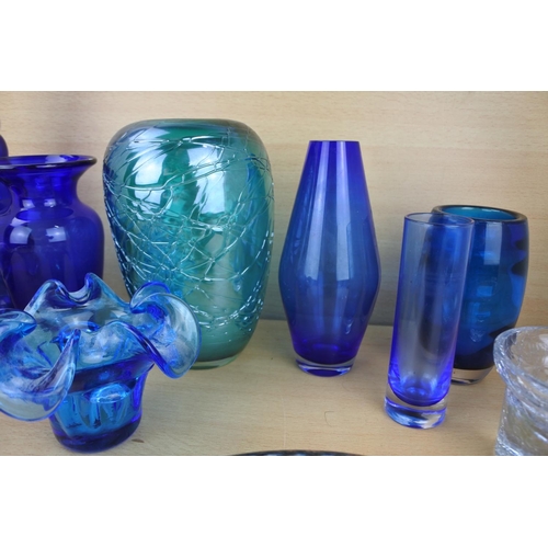 862 - A large collection of vintage blue glass ware.