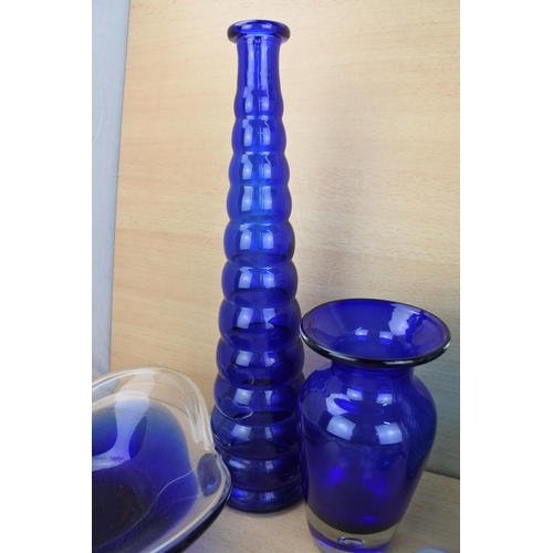 862 - A large collection of vintage blue glass ware.