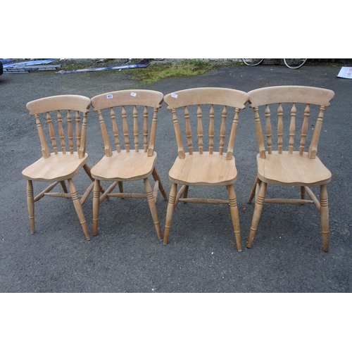 863 - A set of four pine kitchen chairs.