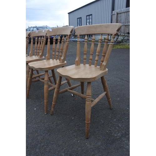 863 - A set of four pine kitchen chairs.