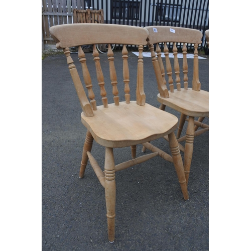 863 - A set of four pine kitchen chairs.