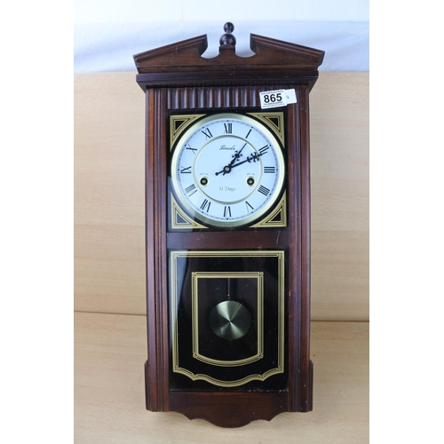 865 - A Lincoln 31 day wall clock.