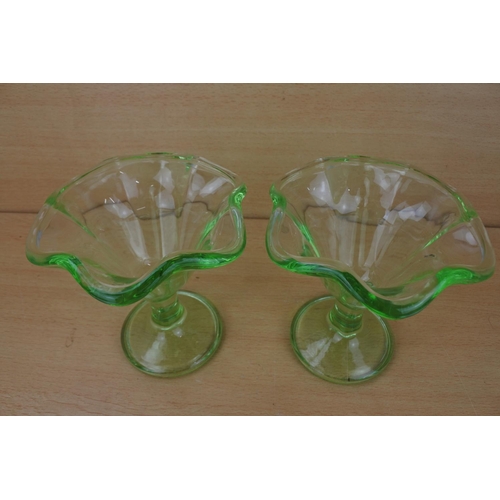 869 - A pair of vintage green glass sundae dishes.