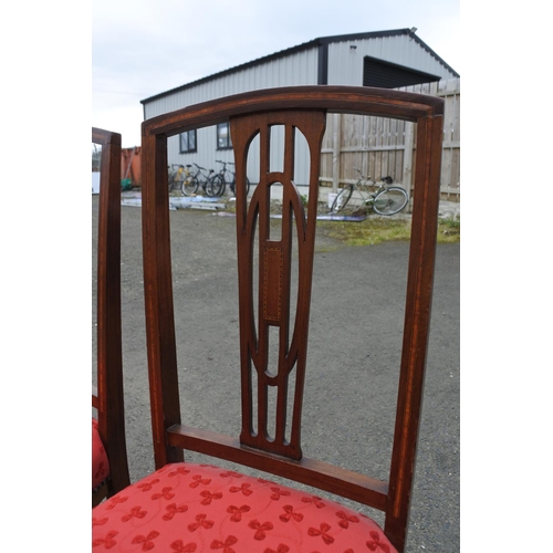 877 - A pair of antique mahogany and inlay chairs.