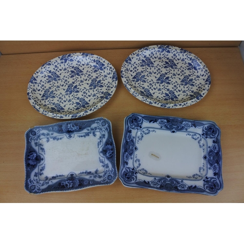 878 - Two antique rectangular dishes (a/f) and two oval blue and white floral patterned plates.