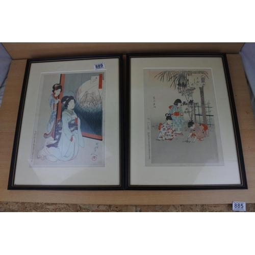 889 - A pair of Oriental framed prints.