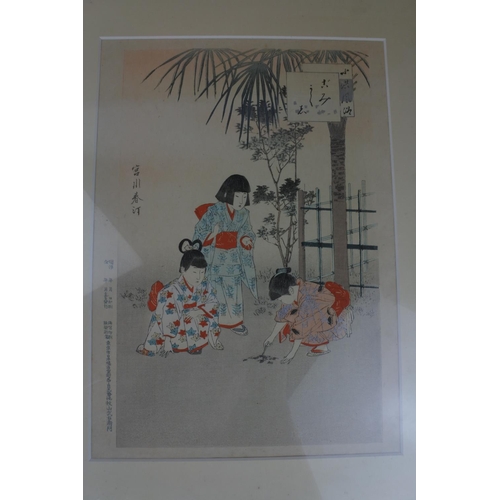 889 - A pair of Oriental framed prints.