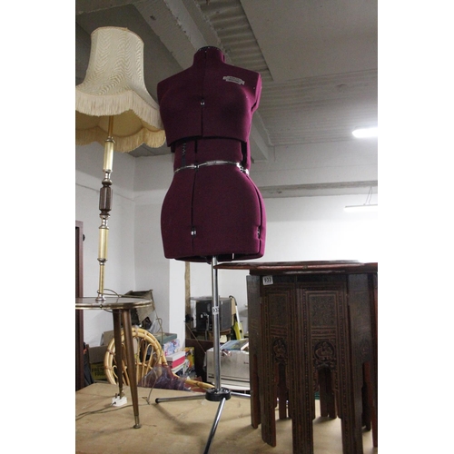 932 - A dressmakers dummy on metal stand.