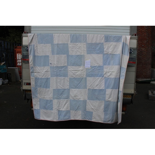 940 - A handmade large blue and white rectangular patchwork quilt. Measuring 68x74inches.