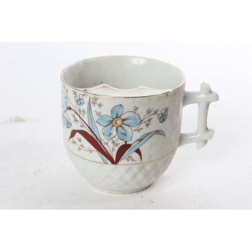 958 - A decorative antique Gents Moustache cup.