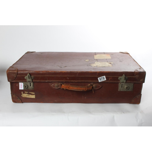 979 - A vintage leather suitcase.