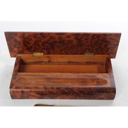 994 - A decorative walnut pen tray/ tidy with 3 pens.