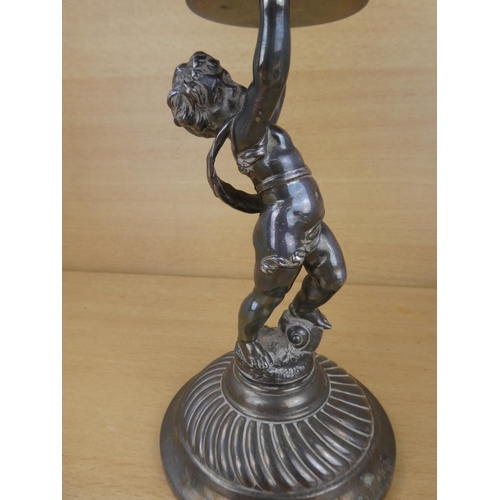 1009 - A decorative silver plated comport, modelled as a boy holding a bowl.