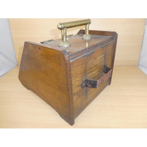 1022 - An antique oak coal box with brass hardware.