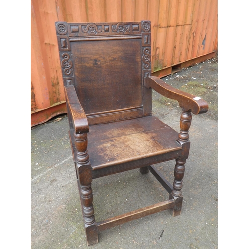 1023 - A stunning antique English oak Wainscot chair, with simple carved design.