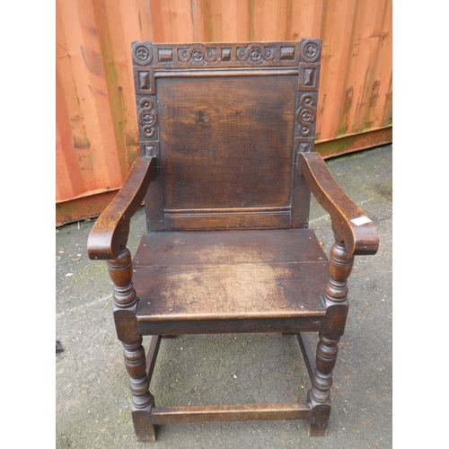 1023 - A stunning antique English oak Wainscot chair, with simple carved design.